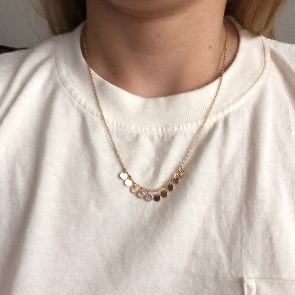 Golden necklace with little round charms
